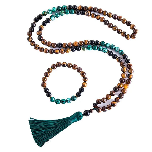 Japamala de Olho de Tigre, Turquesa Africana e Ônix Negra com 108 contas para meditação e equilíbrio energético. Inclui pulseira combinando, ideal para fortalecer a prática espiritual.