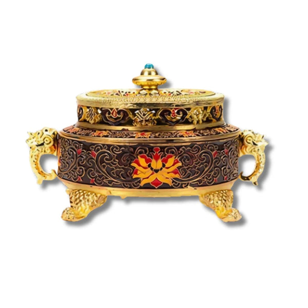 Incensário decorativo com detalhes dourados e flor vermelha no centro.