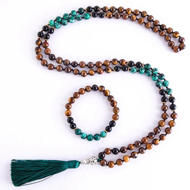 Conexão espiritual com o Japamala Olho de Tigre, Turquesa Africana e Ônix Negra, ajudando na meditação e promovendo equilíbrio emocional e proteção energética.